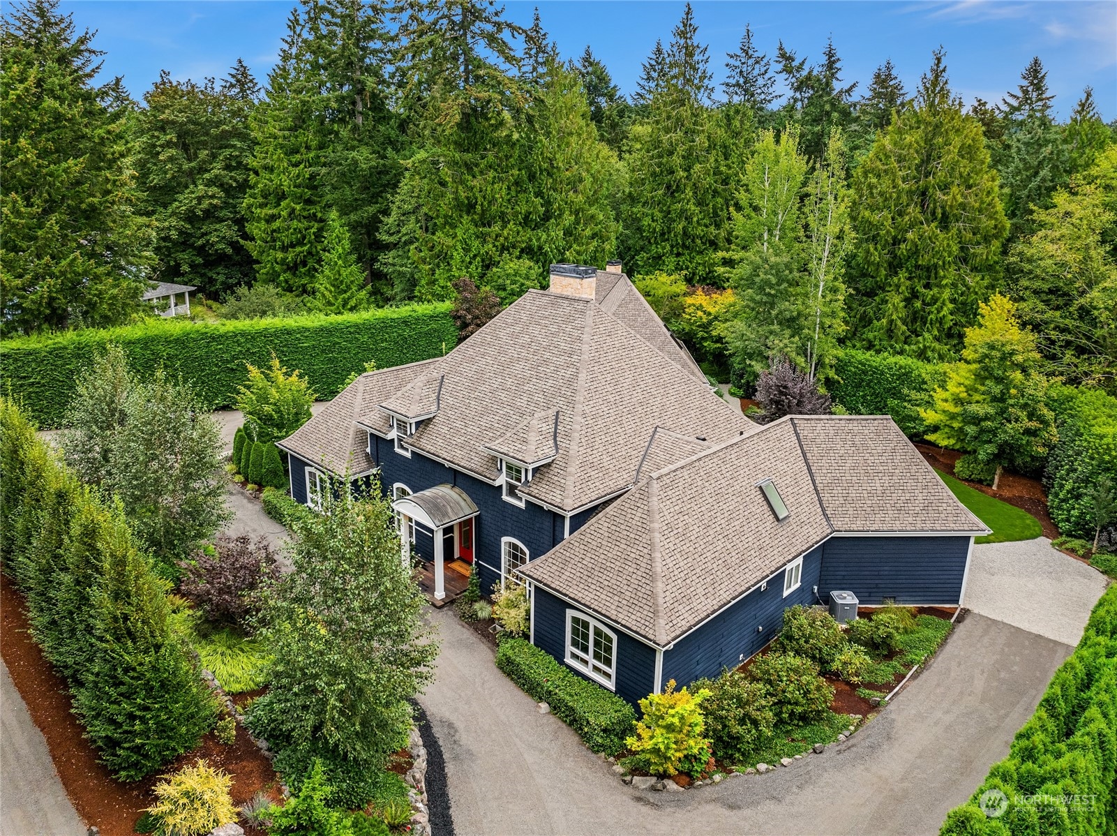 an aerial view of a house with big yard