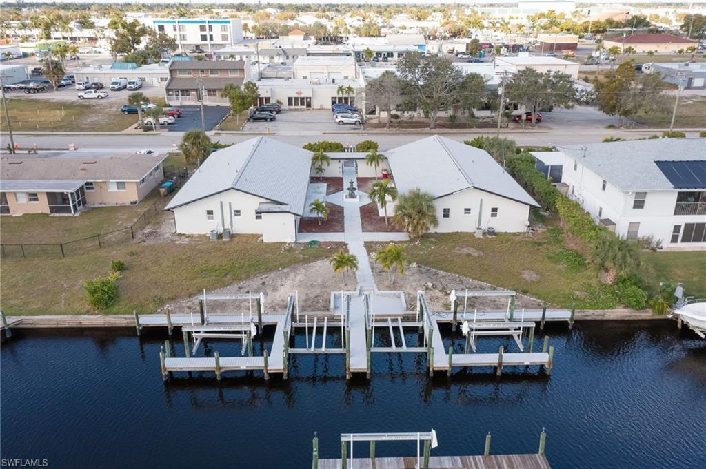 an aerial view of houses with yard