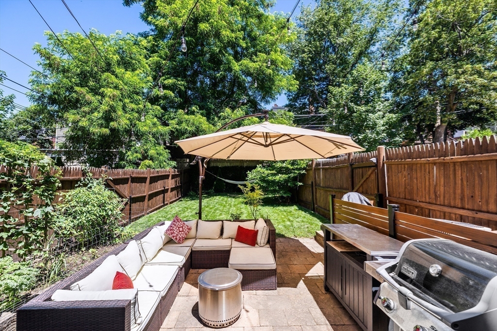 swimming pool view with a seating space