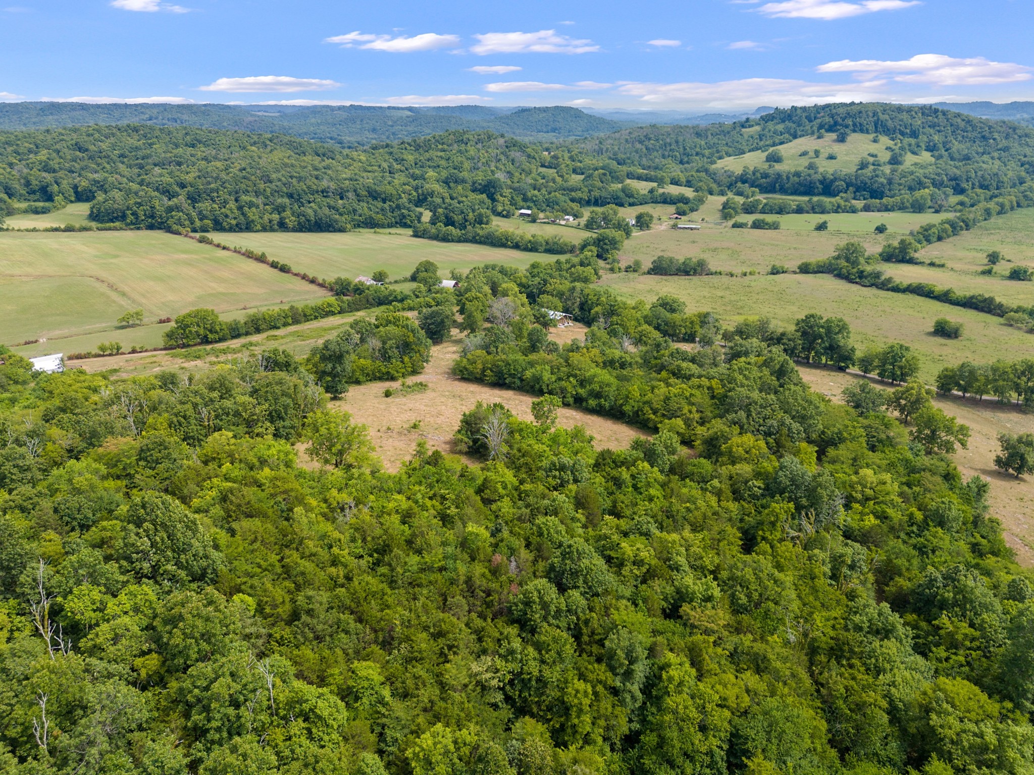 an aerial view of a houses with a yard