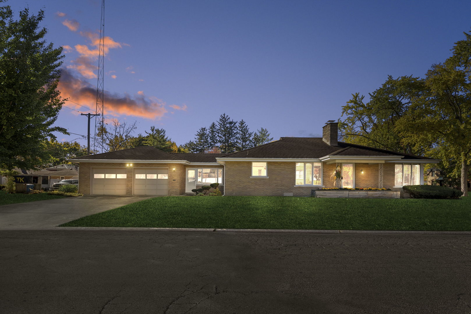 a view of house with outdoor space and garden