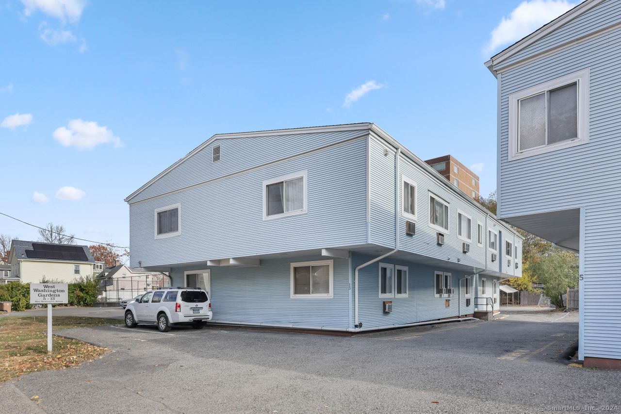 a view of a car park in front of house