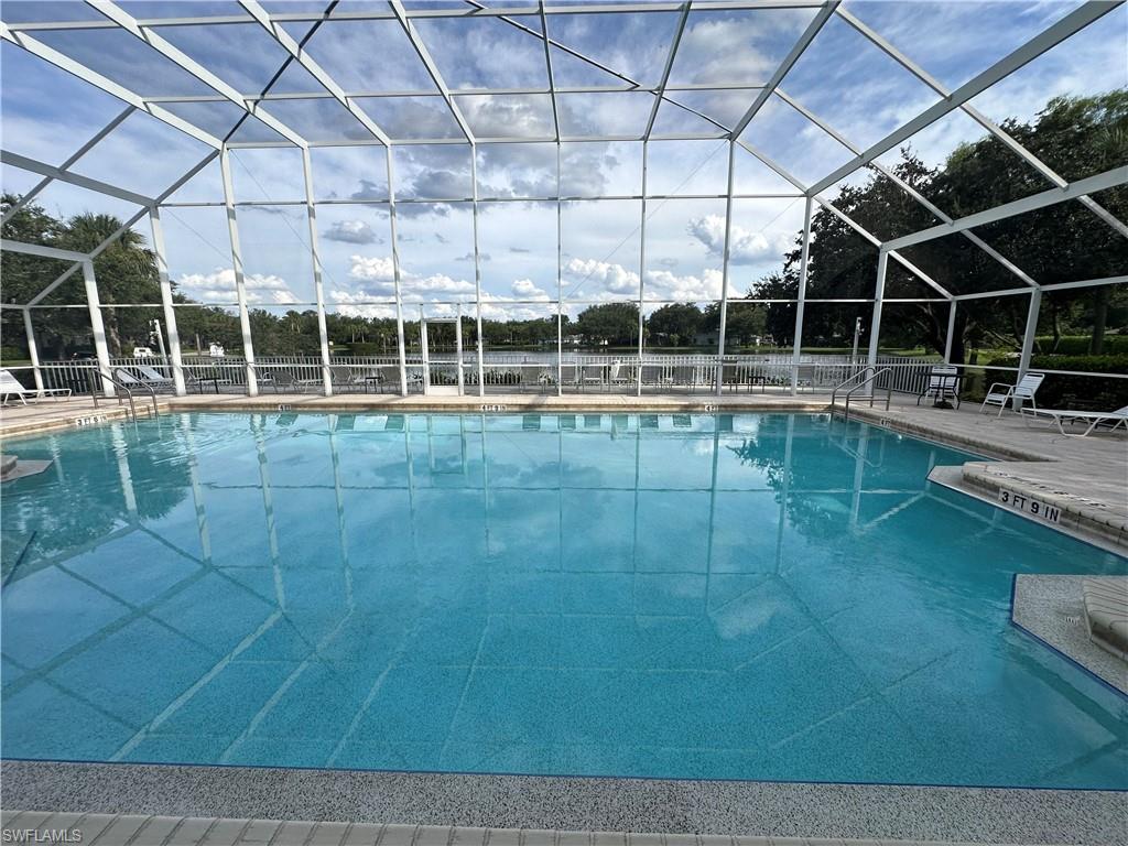 a view of a swimming pool with seating space