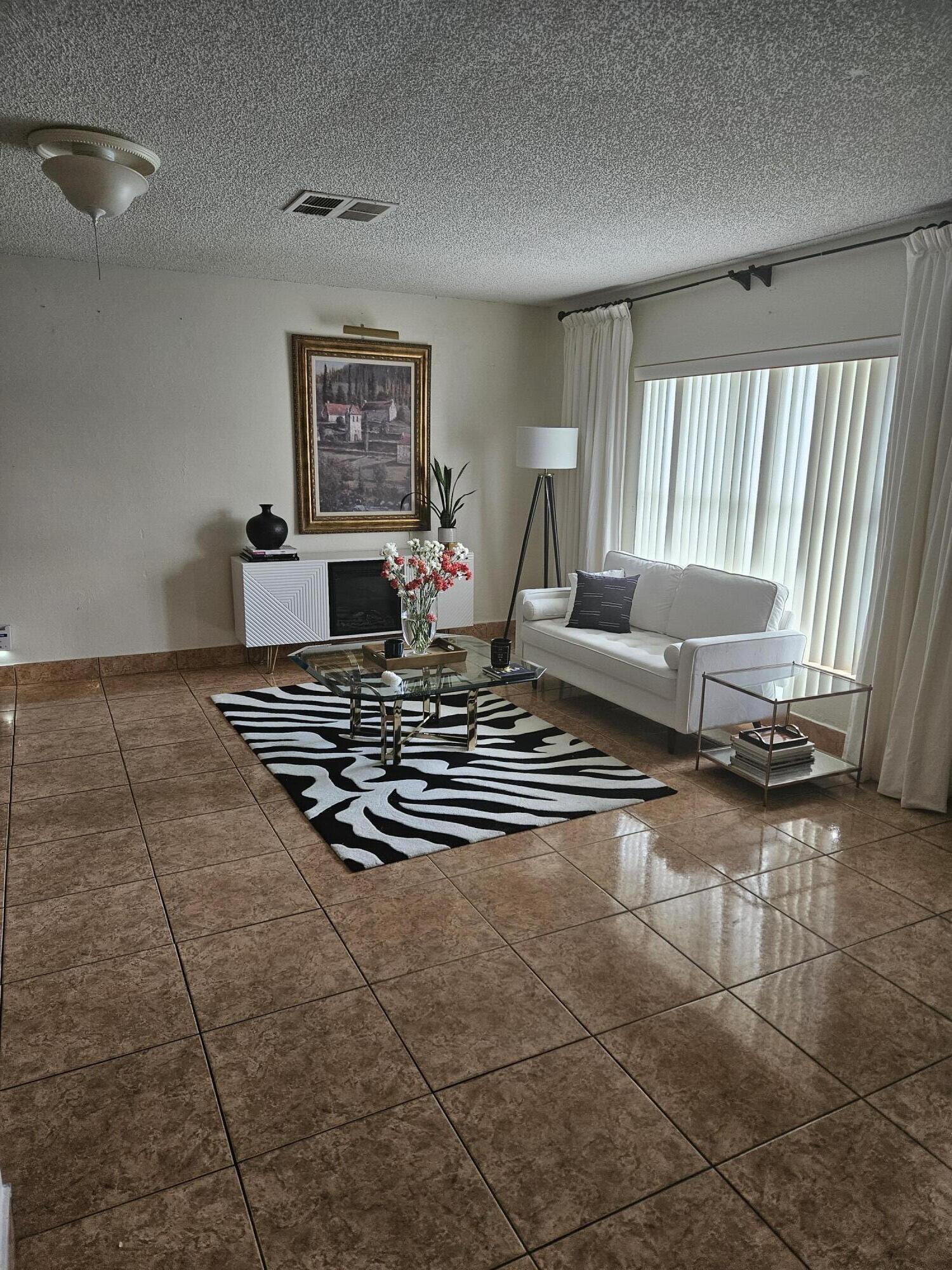 a living room with a couch and a table