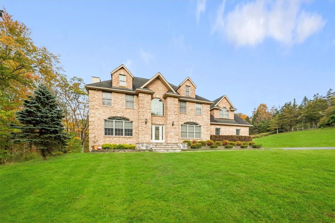 View of front of house with a front yard