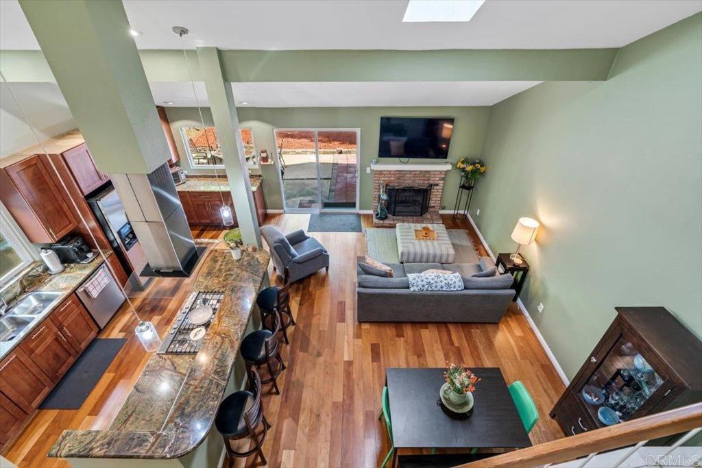 a view of living room with furniture and a fireplace