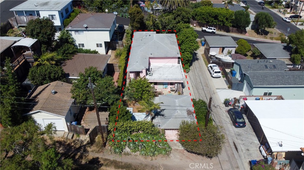 an aerial view of residential houses with outdoor space