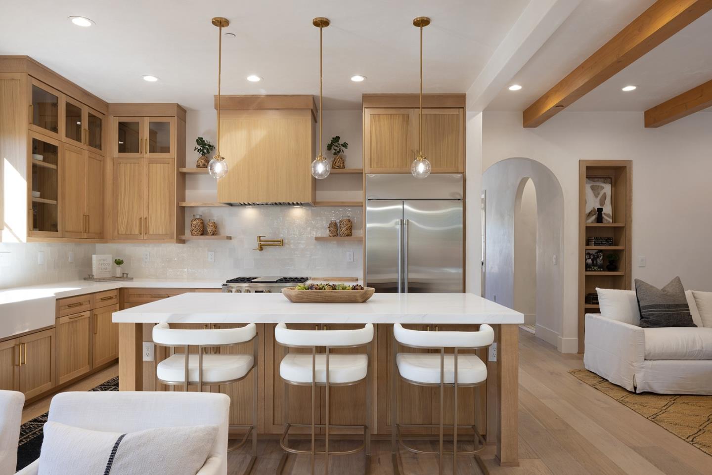 a kitchen with a table chairs stove and wooden floor