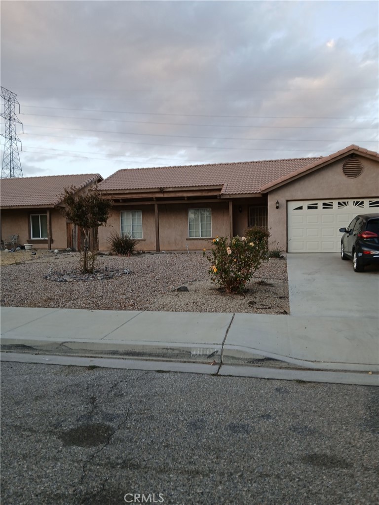 a view of house and car parked