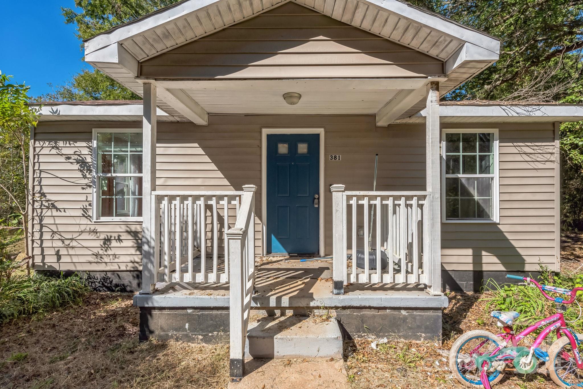 a front view of a house with a porch