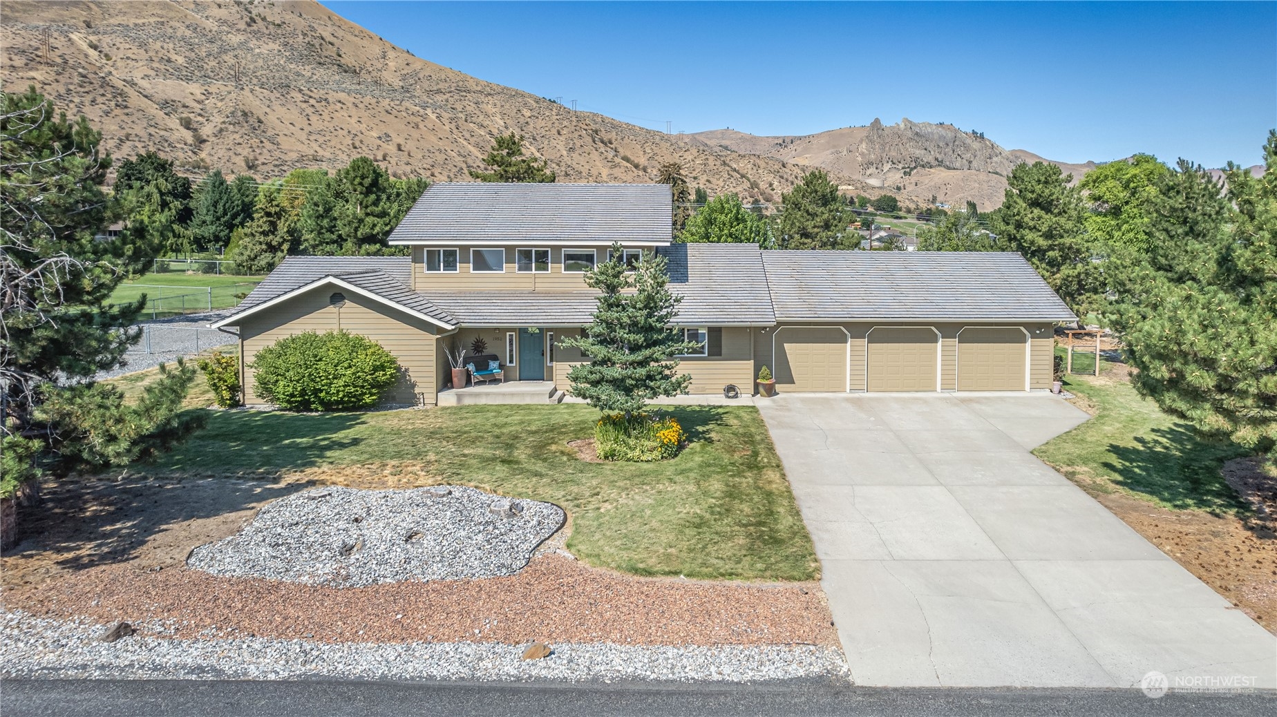 front view of a house with a yard