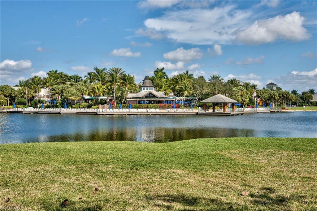 a view of a lake with houses in the back