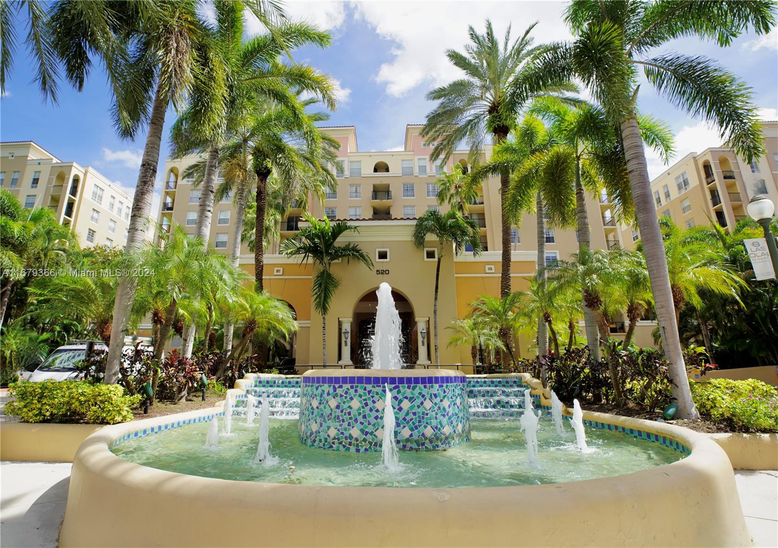 a view of swimming pool with a garden and plants