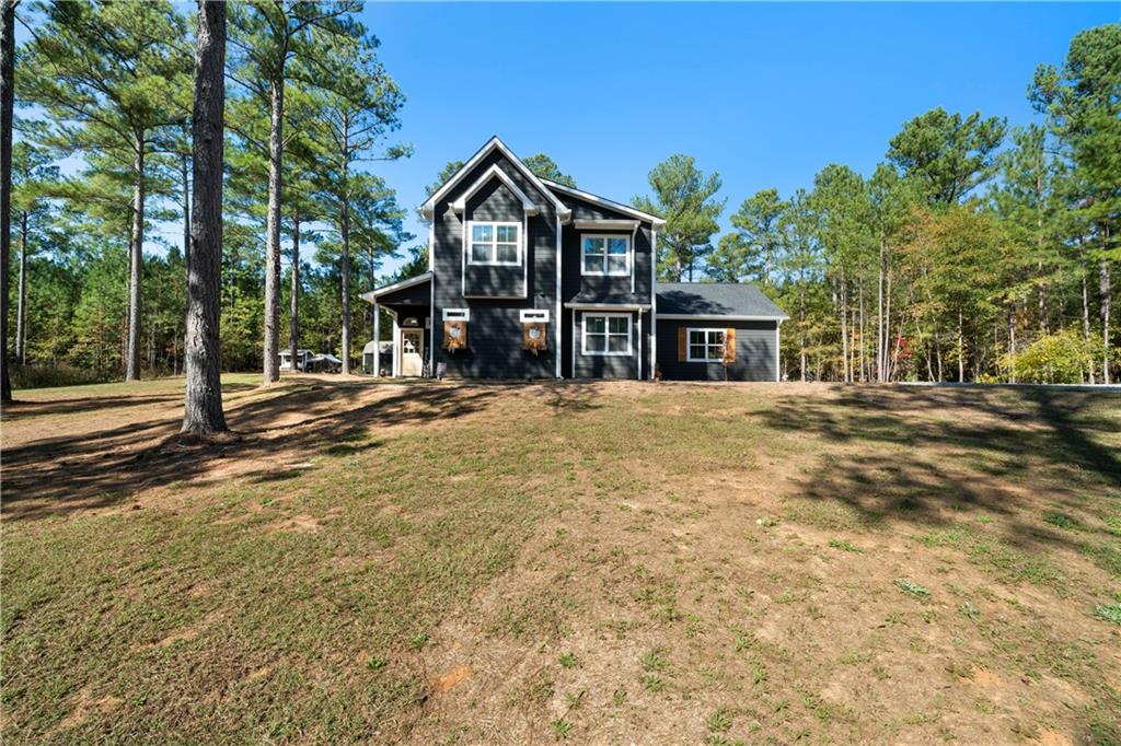 a front view of a house with a yard