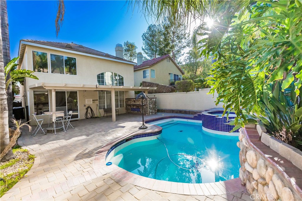 a view of a swimming pool with a patio