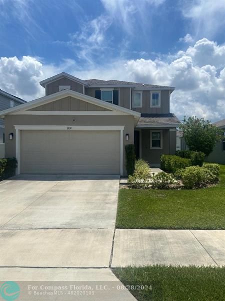 a front view of house with yard