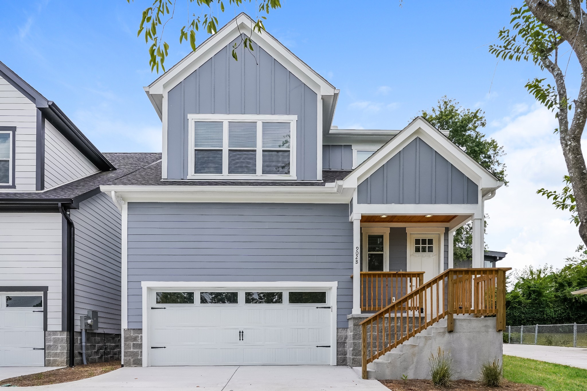 a view of house with outdoor space and a parking space