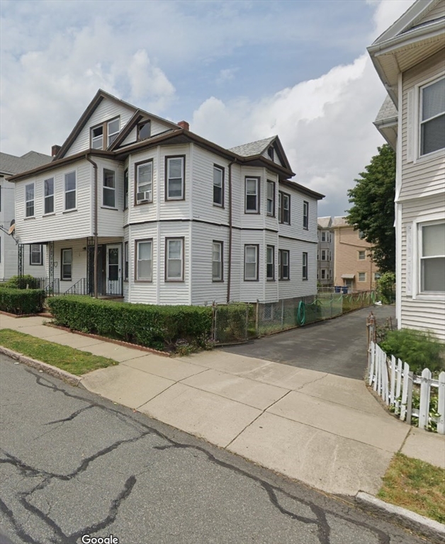 a front view of a house with yard