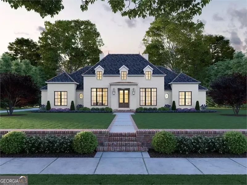 a front view of a house with a garden