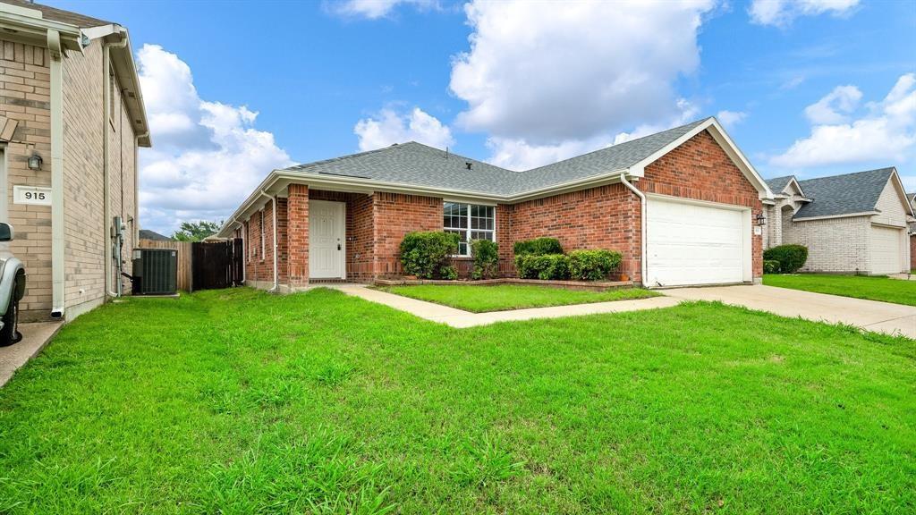 a view of house with yard and green space