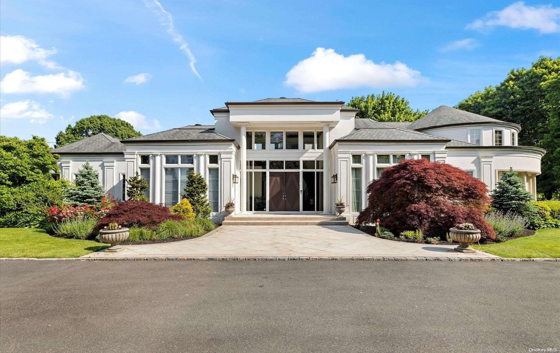 front view of a house with a garden