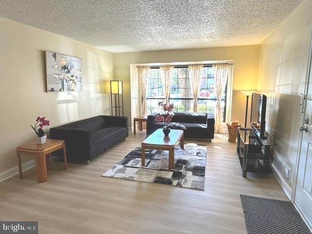 a living room with furniture window and a flat screen tv