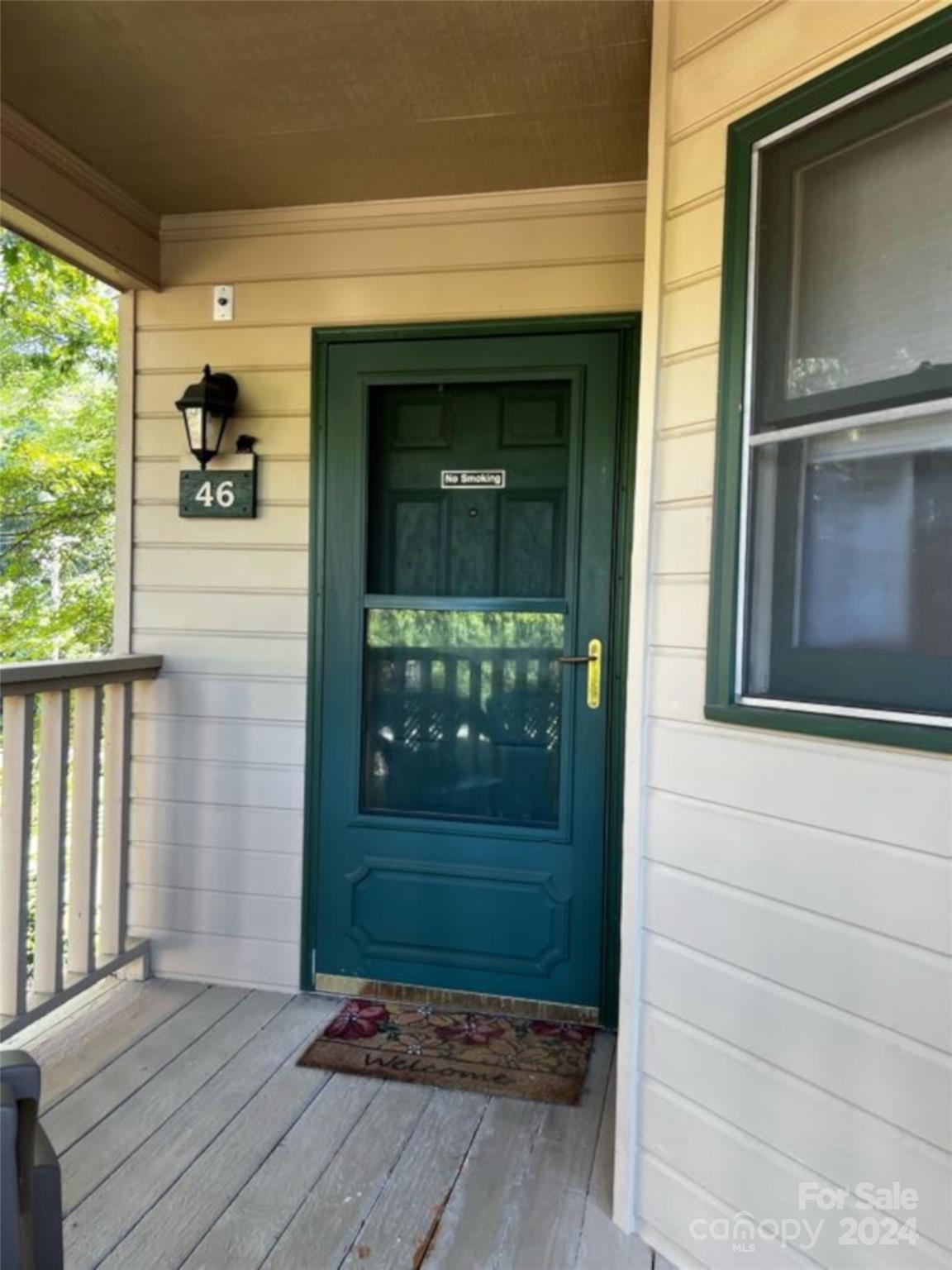 a front view of a house with a porch