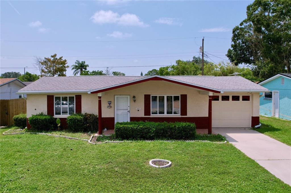 a view of a yard in front of a house