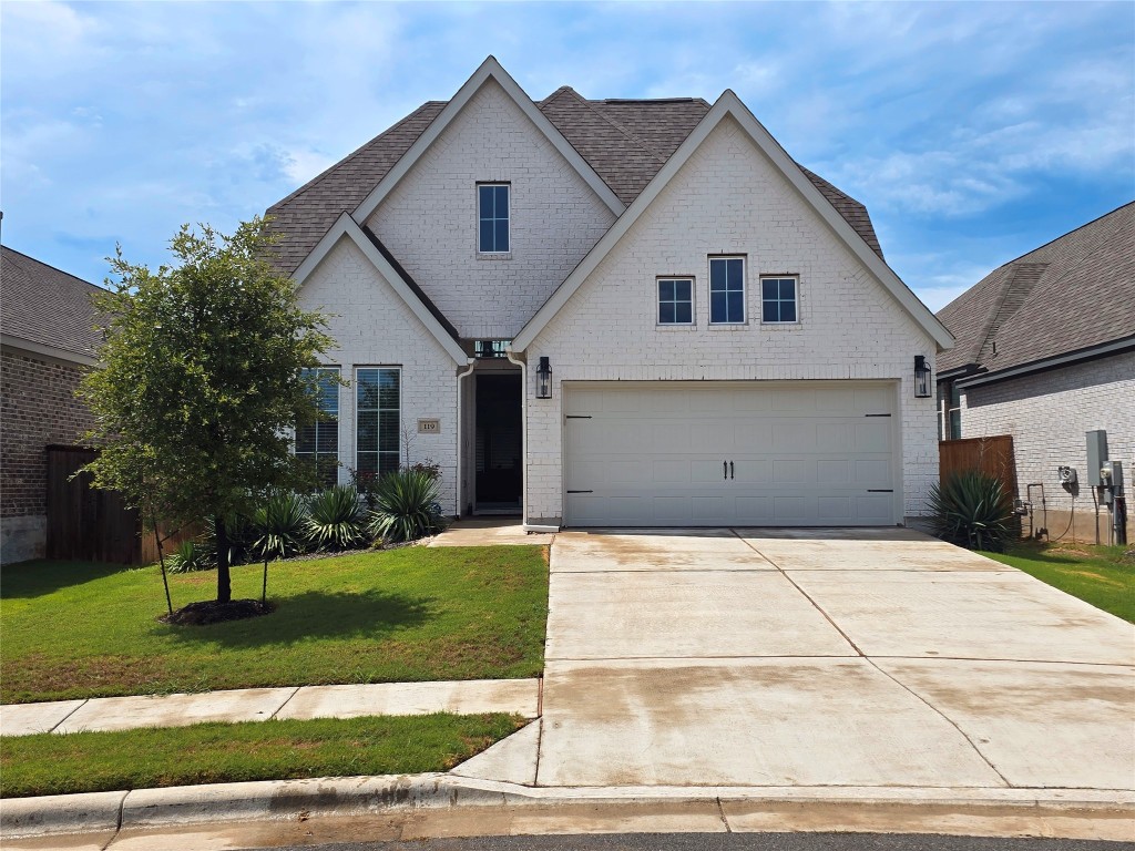 a view of house and yard with green space