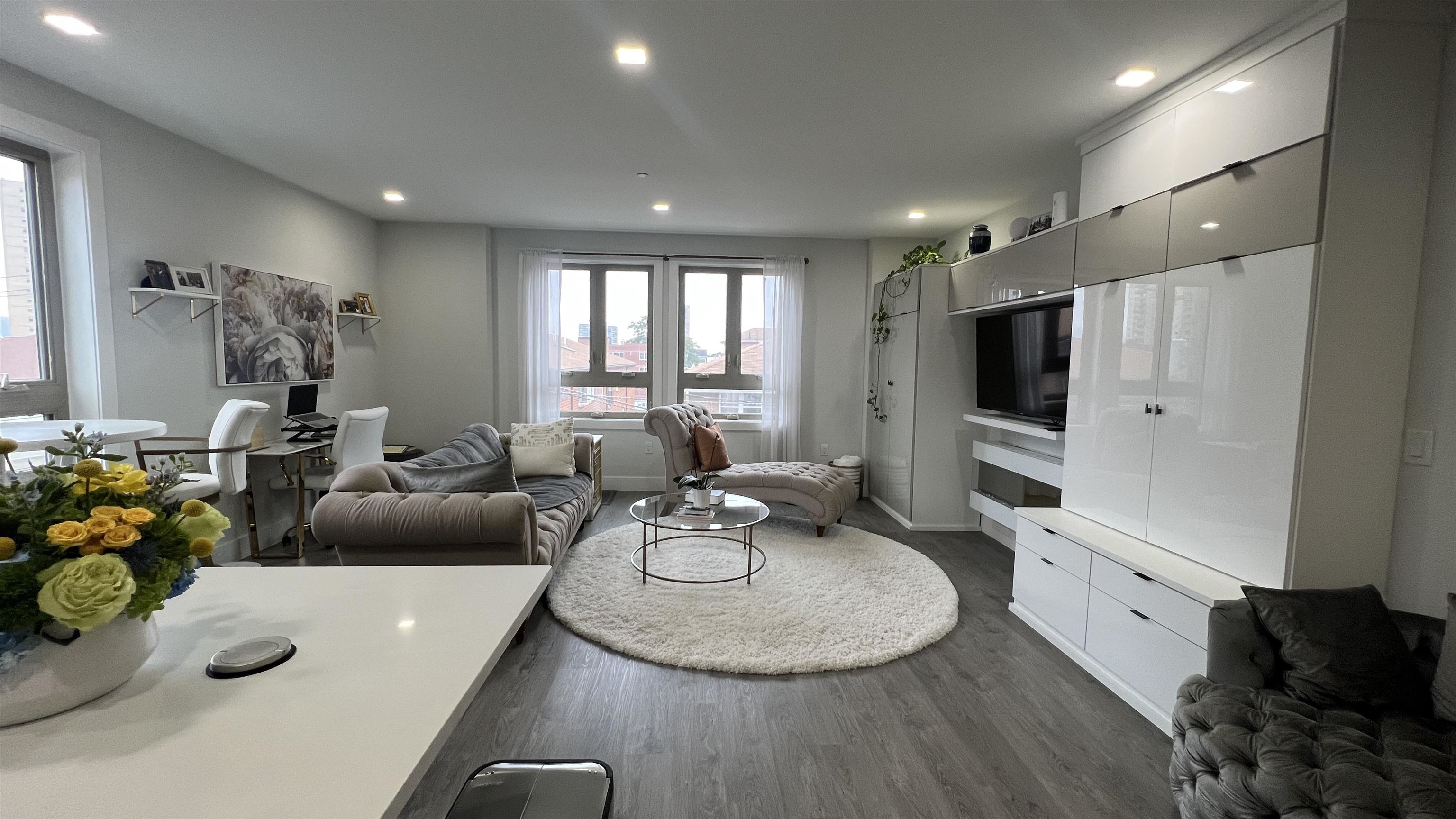 a room with furniture and a flat screen tv