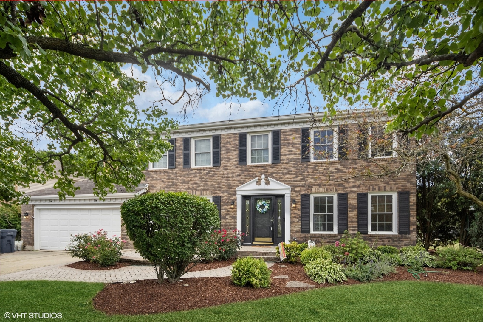 front view of a house with a yard