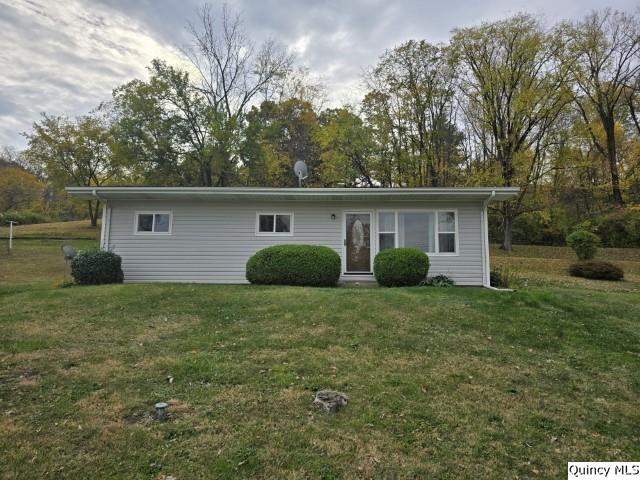 a view of a house with backyard and garden