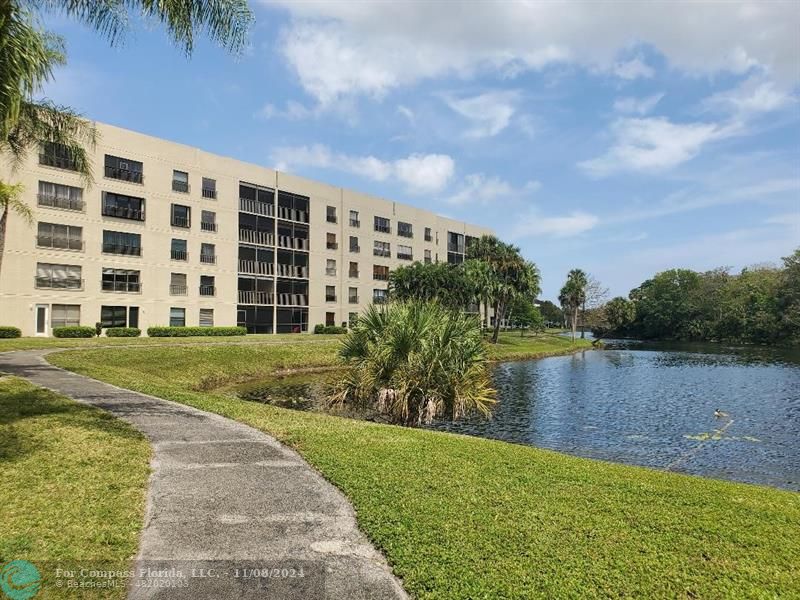 a view of a lake with a building in the background