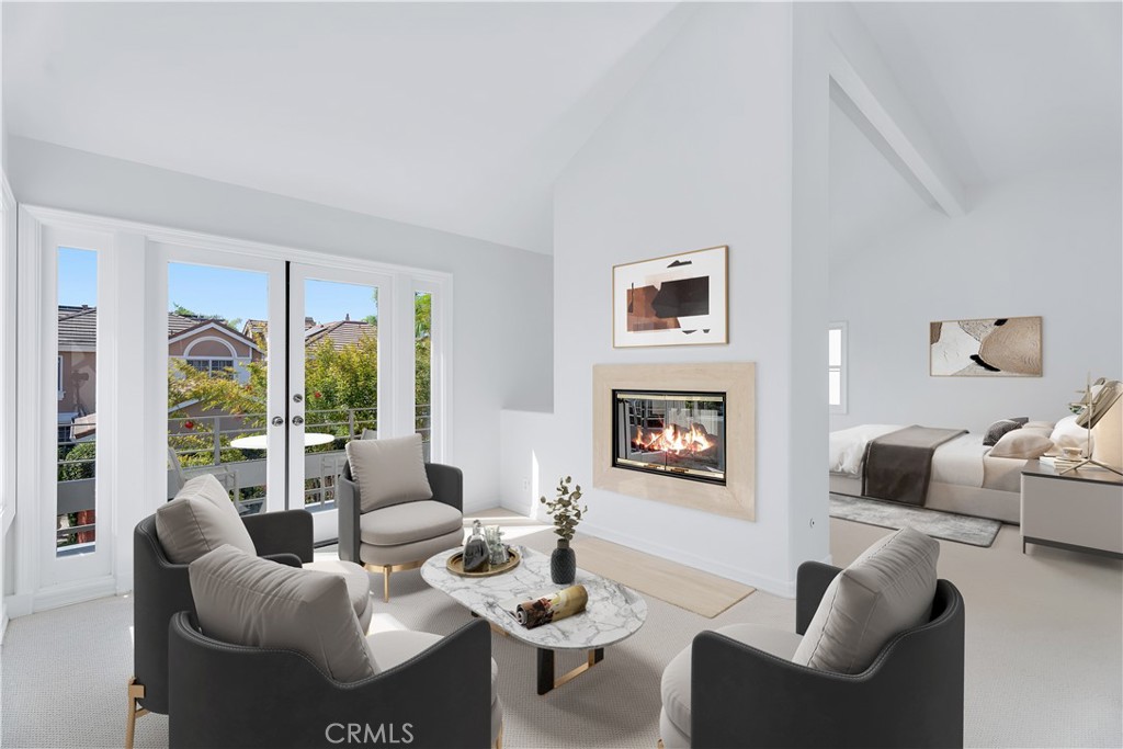 a living room with furniture and a floor to ceiling window