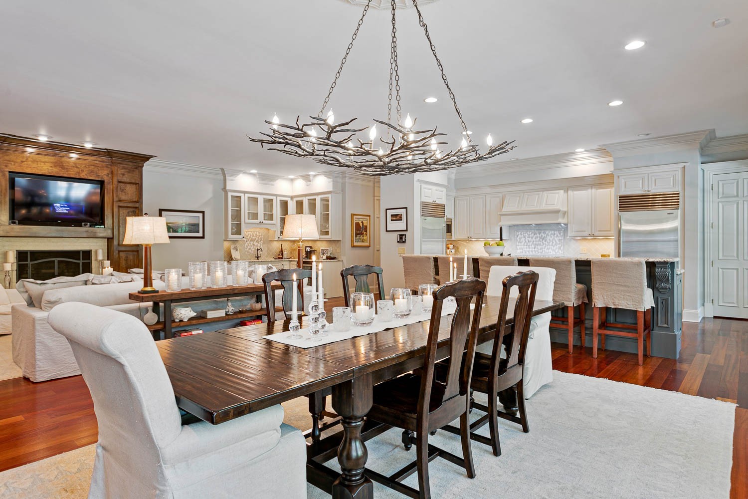 a view of a dining room with furniture a chandelier and chandelier