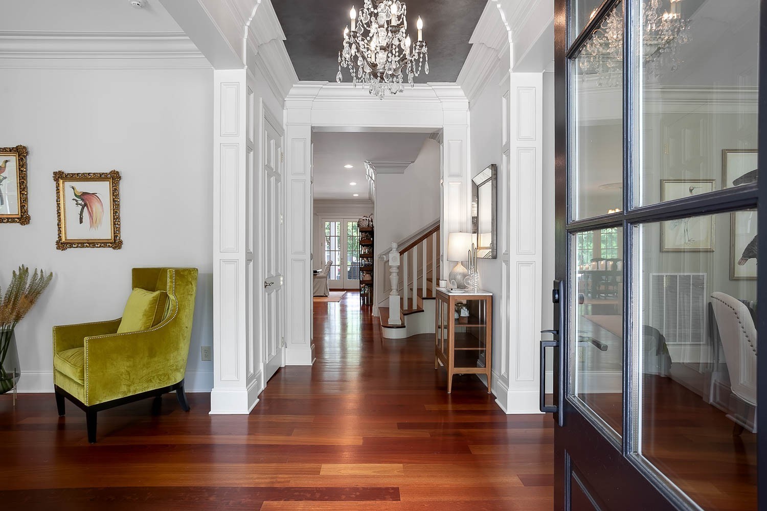 a view of a livingroom with furniture and hardwood floor