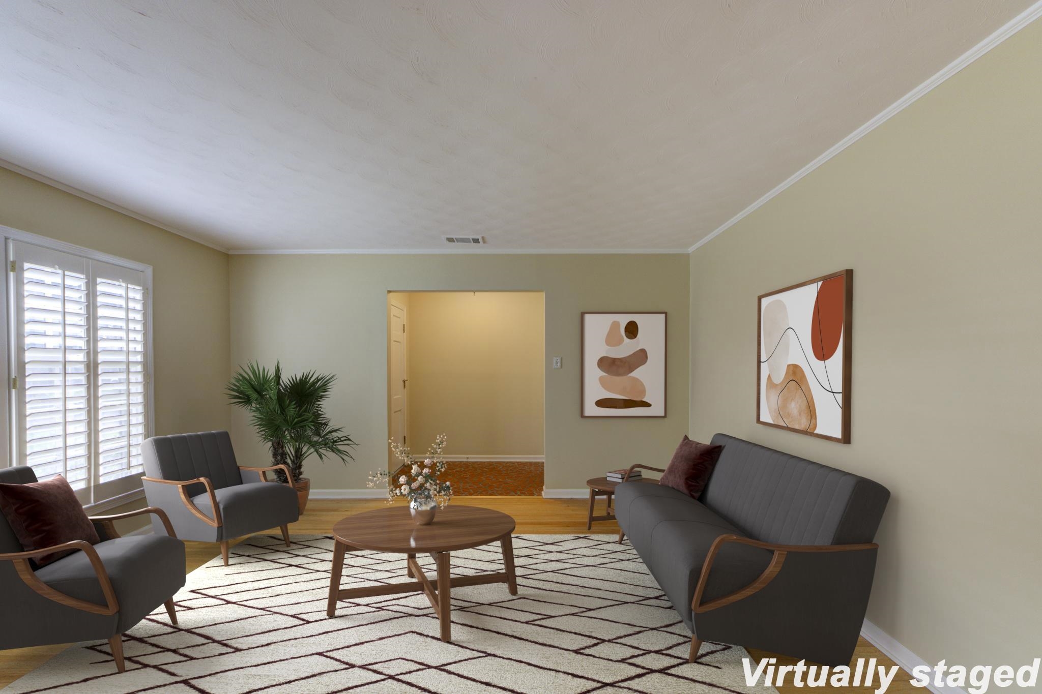 Living room featuring light wood-type flooring and crown molding