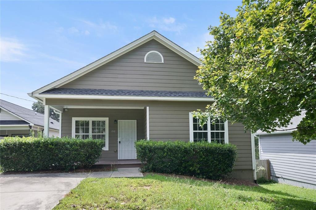 front view of a house with a yard