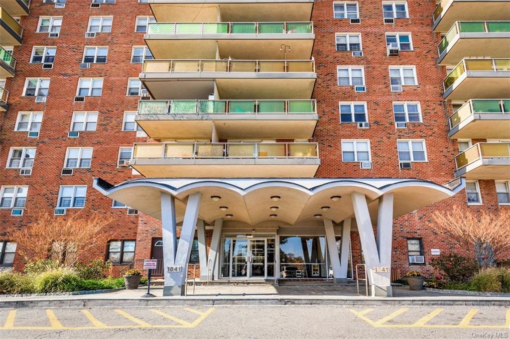 a view of a building with a umbrellas