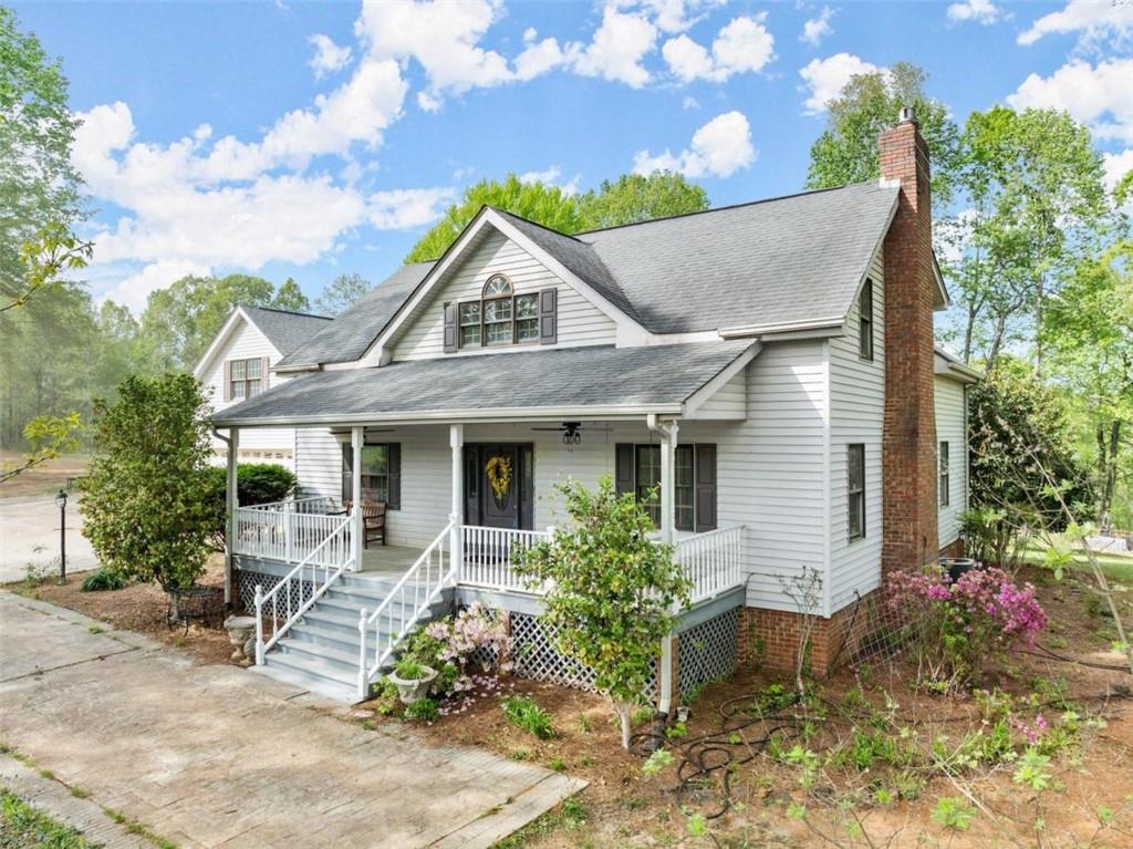 a front view of a house with garden