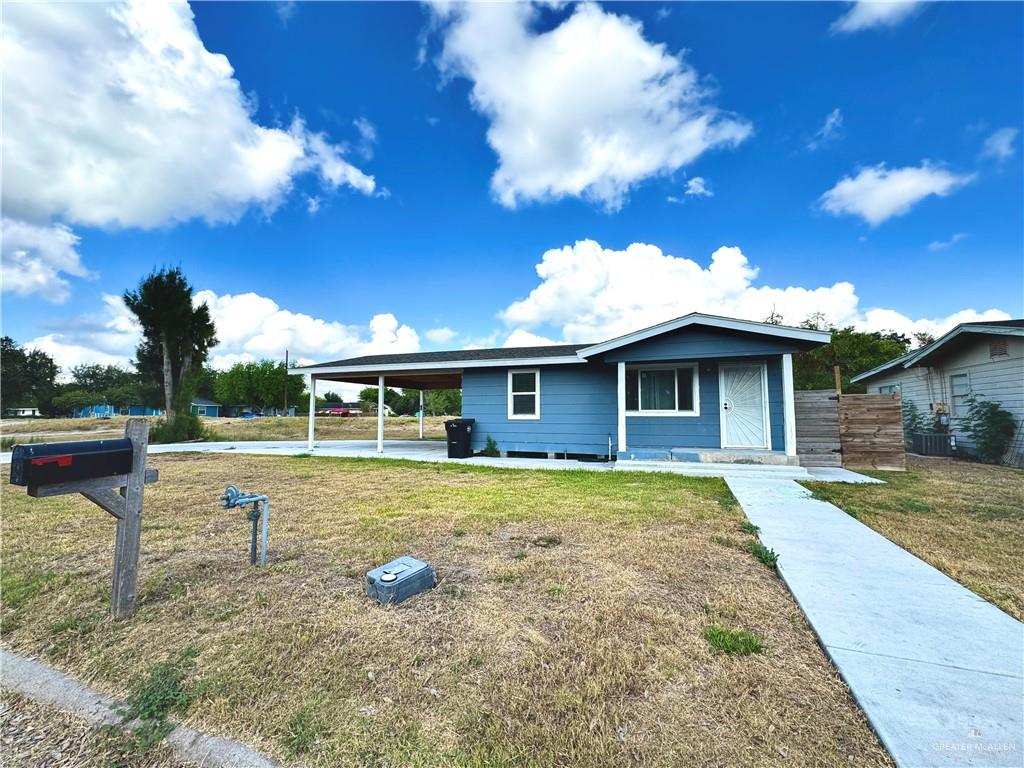 a front view of a house with yard