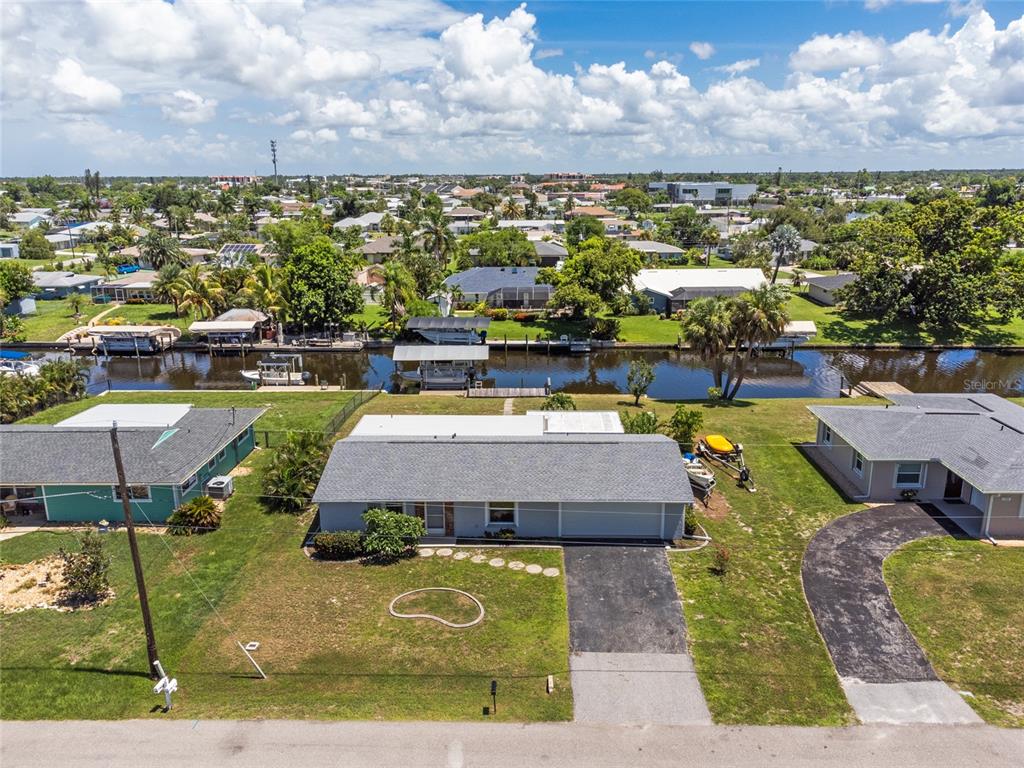 an aerial view of a house with a swimming pool yard and outdoor seating