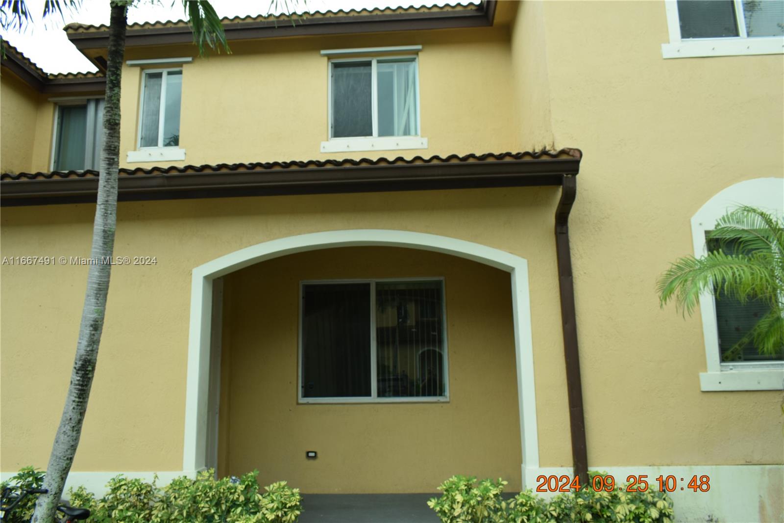 a front view of a house with swimming pool