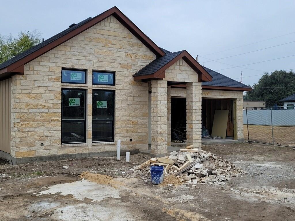 a front view of a house with yard