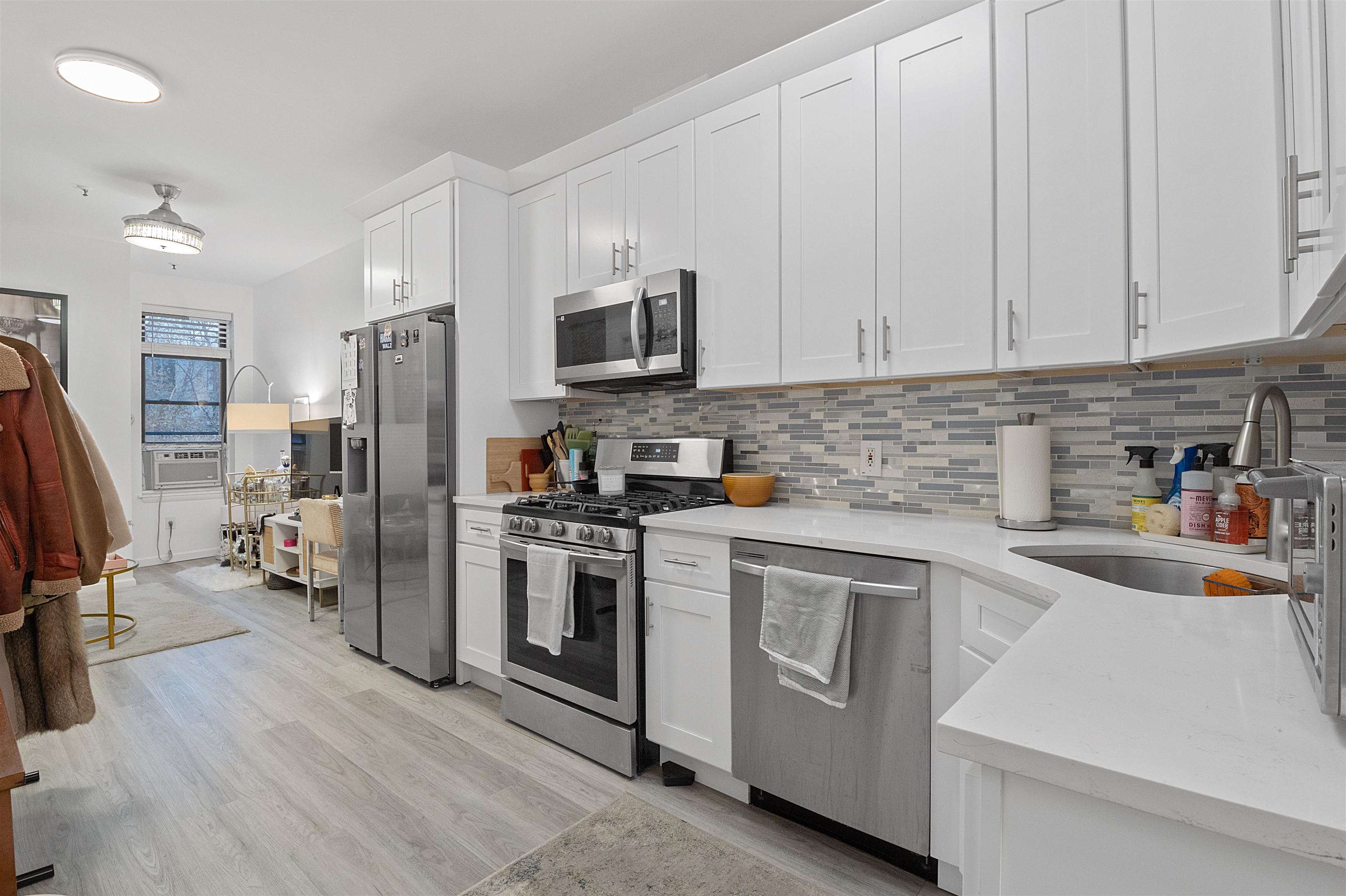 a kitchen with a refrigerator stove and sink