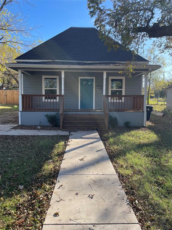 front view of a house with a yard