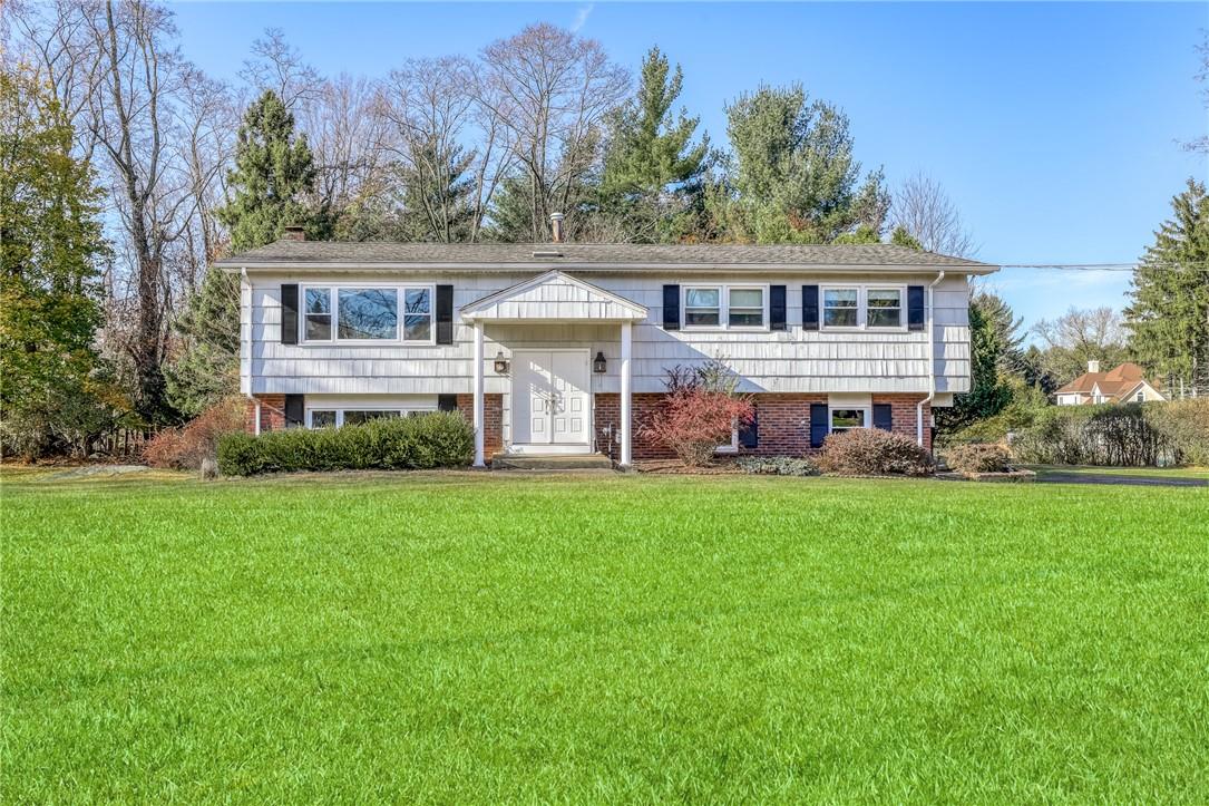 a front view of house with yard and seating area