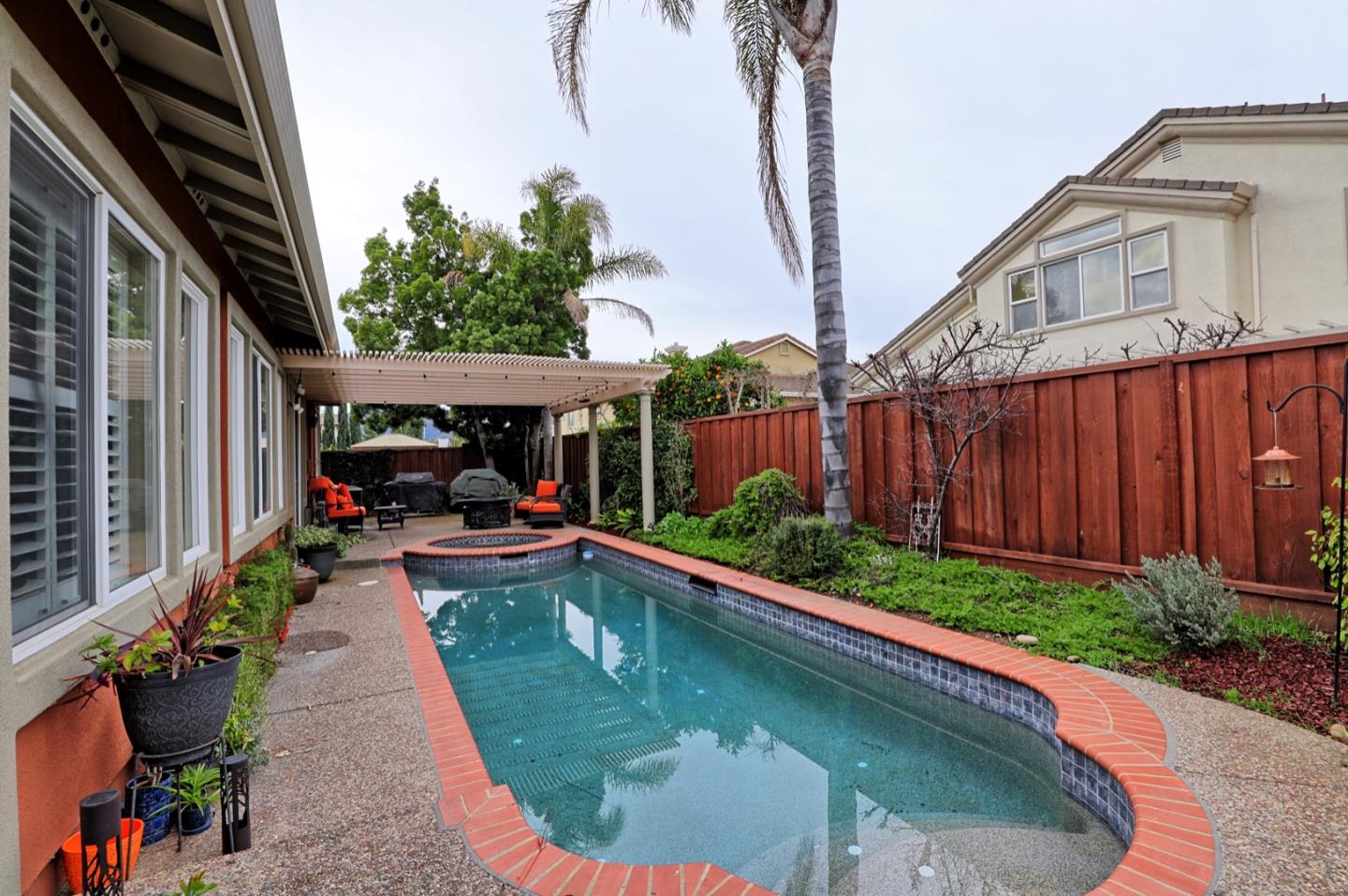 a view of a backyard with sitting area