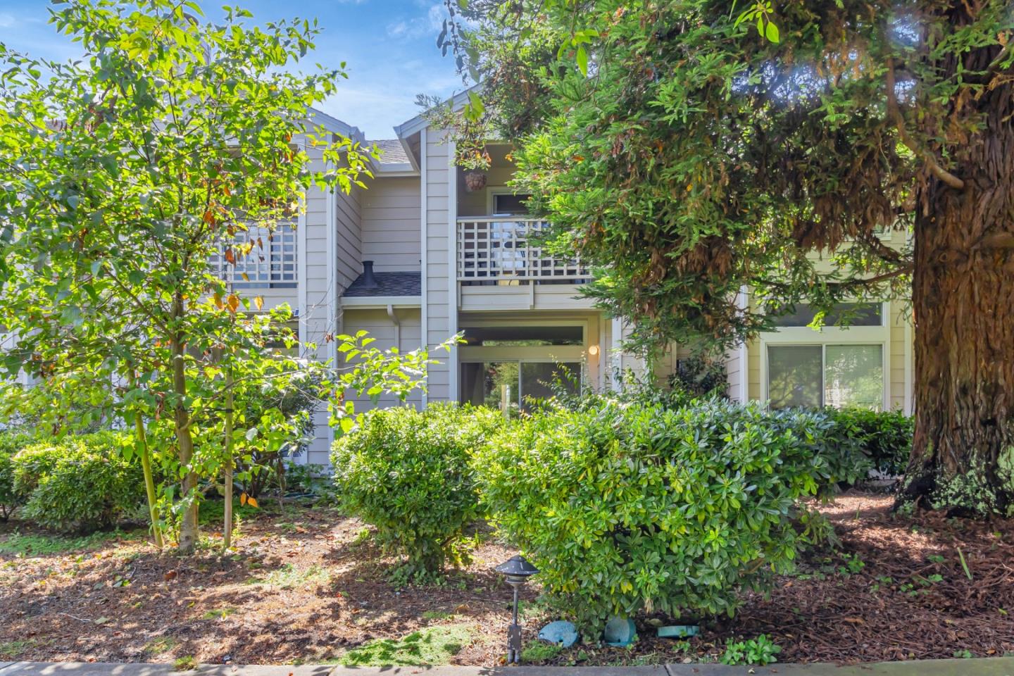 front view of a house with a garden