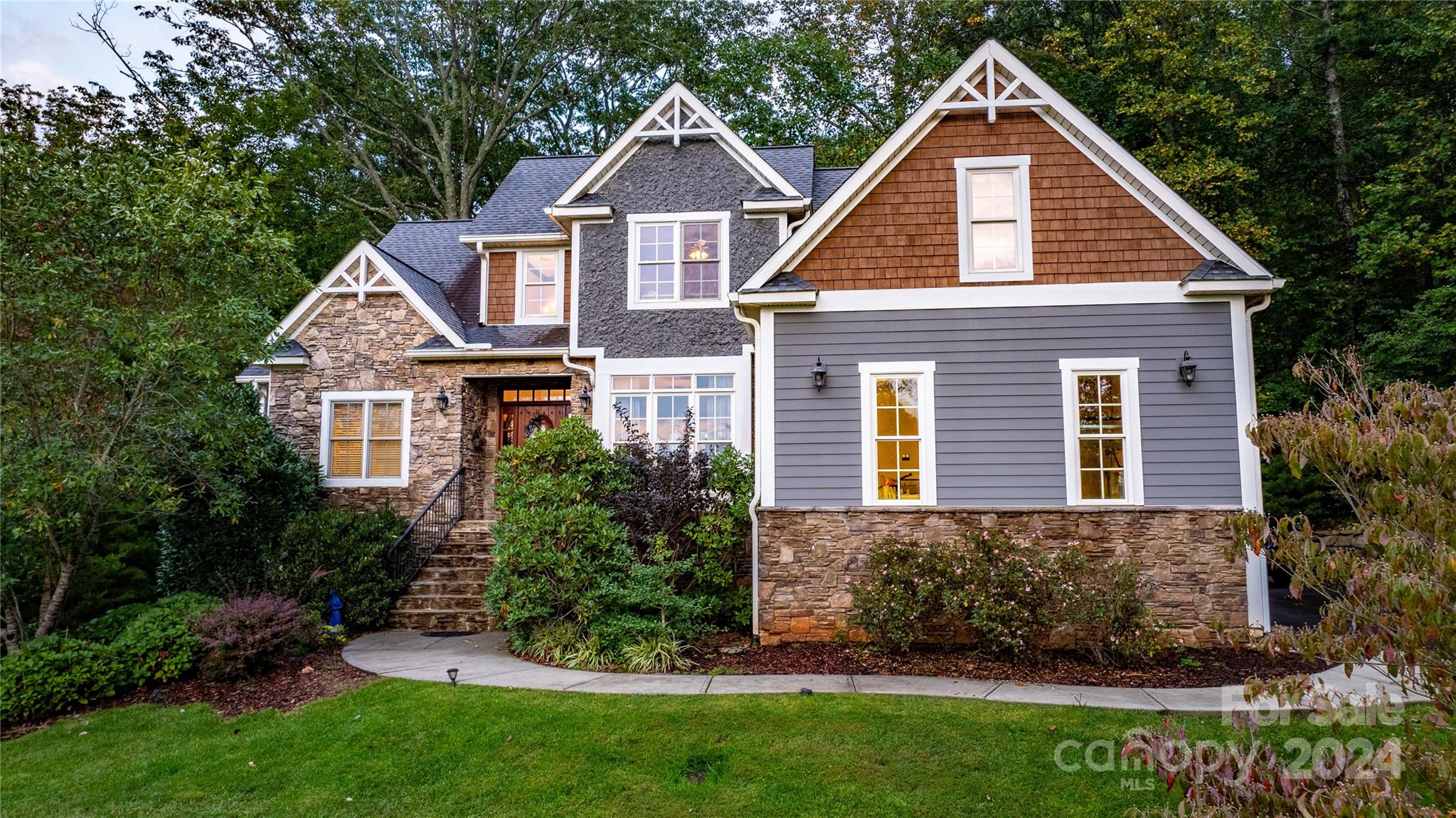 a front view of a house with a yard